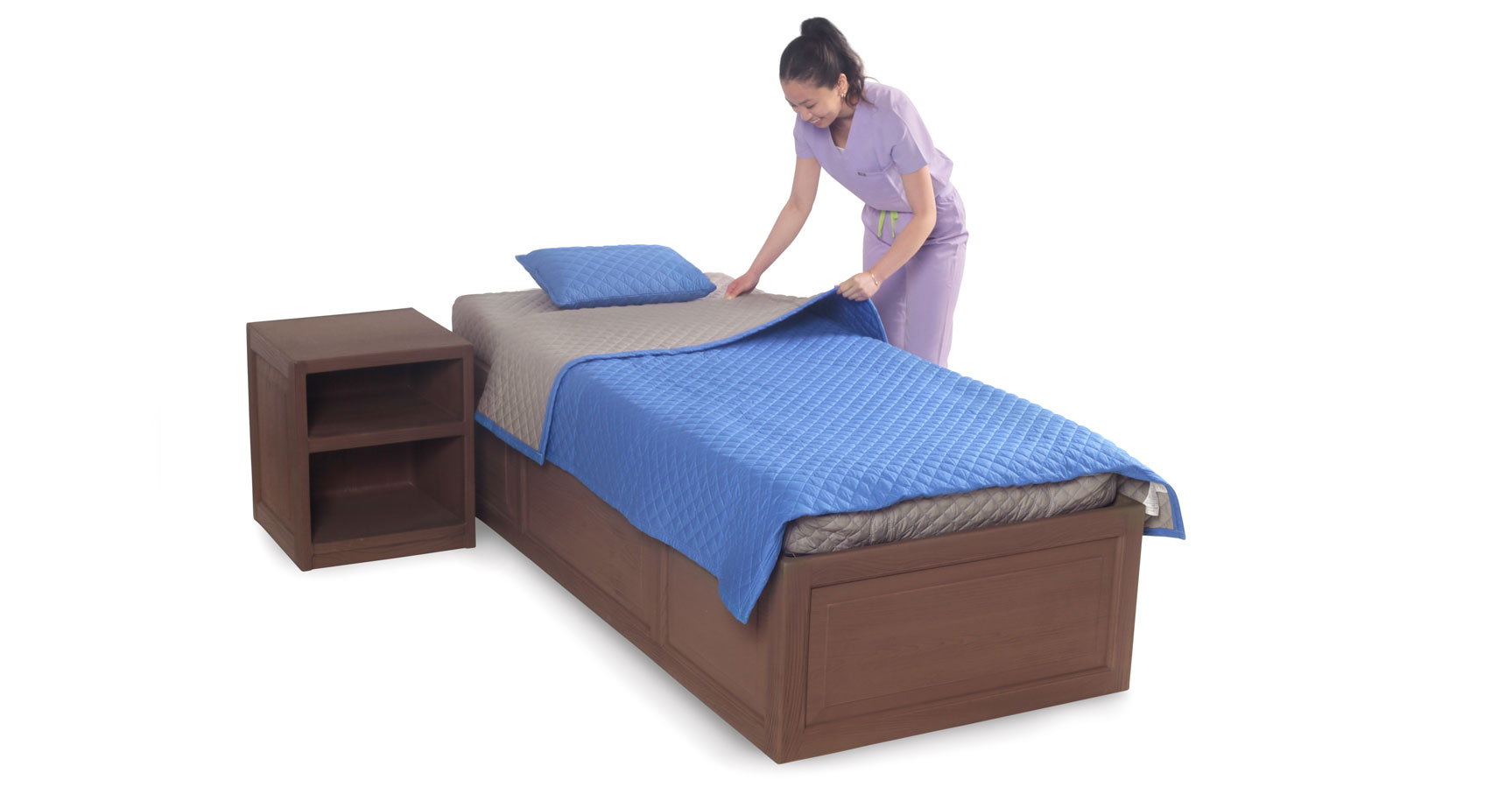 Girl making bed, featuring safety bedding in navy blue color